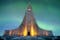 photo of hallgrímskirkja is a lutheran (Church of Iceland) church in Reykjavík It is the largest church in Iceland and the tallest structures in Iceland .There is an colorful aurora borealis in background.