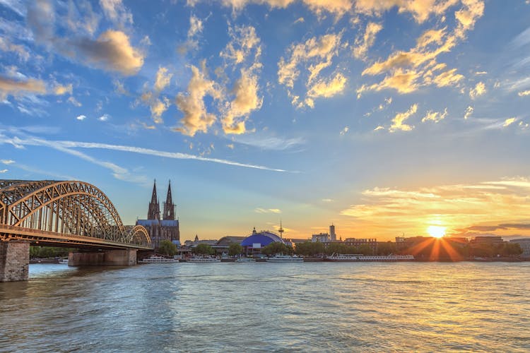 Photo of Cologne sunset city skyline with Cologne Cathedral and Rhine River, Cologne, Germany.