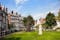 photo of famous historic Begijnhof (Beguinage, 1346) is one of the oldest inner courts in the city of Amsterdam. Begijnhof was founded during the middle Ages. Amsterdam, Netherlands.