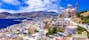 Photo of aerial view of beautiful Syros island panoramic view with church and port, Ermoupoli, Greece.