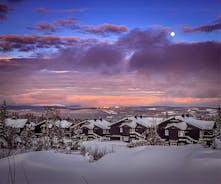photo of beautiful vibrant aerial winter mountain view of ski resort Trysil, Norway. sunny winter day with slope, piste and ski lift.
