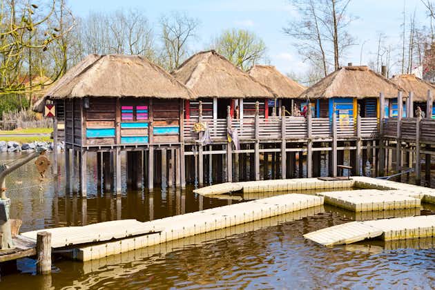 Photo of Thai village huts on the water at Pairi Daiza, Belgium.