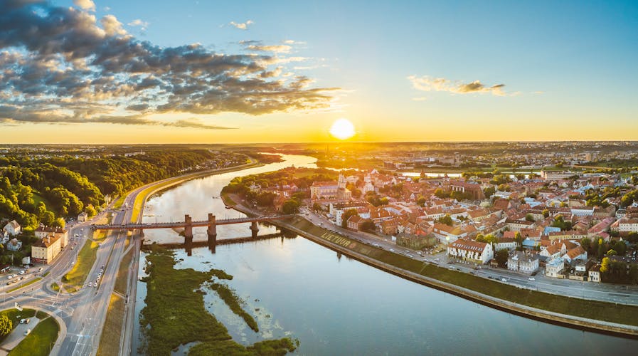 Photo of Kaunas old town, Lithuania. Drone aerial view. Summer sunset.