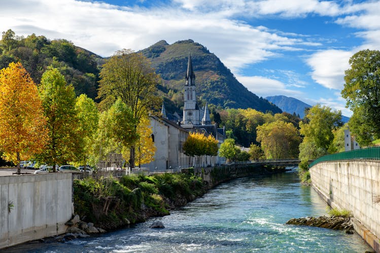 Photo of view of the basilica of Lourdes in autumn, France.