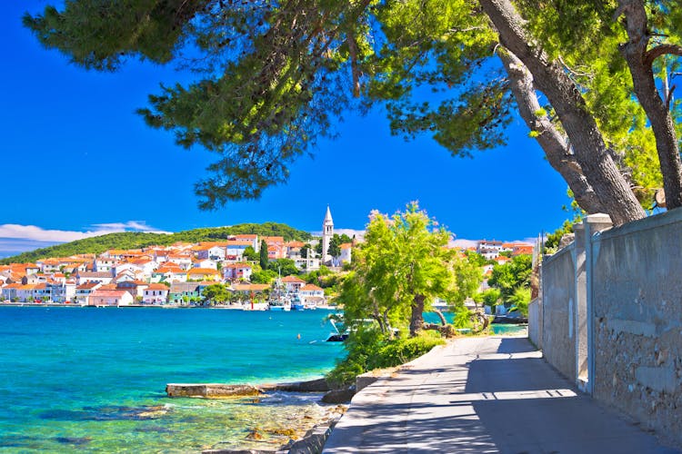 Photo of Zadar archipelago. Kali on Ugljan island turquoise sea and walkway view.