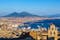 photo of Napoli (Naples) and mount Vesuvius in the background at sunset in a summer day, Italy, Campania,Ottaviano  Italy.
