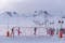 photo of panoramic view of Erciyes Ski Resort with people skiing on the ski slope in Kayseri, Turkey.