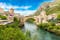 Photo of Stari Most is a reconstruction of a 16th-century Ottoman bridge in the city of Mostar in Bosnia and Herzegovina that crosses the river Neretva and connects two parts of the city.