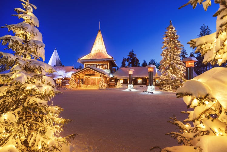Photo of winter night view of Santa Claus Village in Rovaniemi in Lapland in Finland.