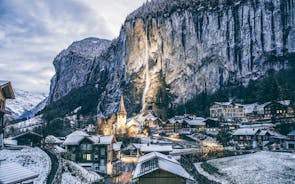 Photo of beautiful autumn view of Lauterbrunnen valley with gorgeous Staubbach waterfall and Swiss Alps at sunset time, Switzerland.