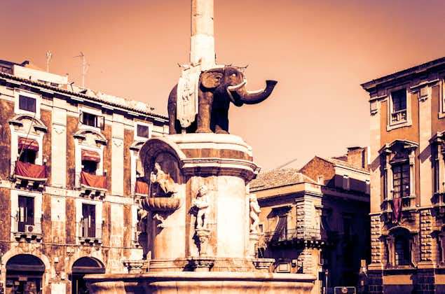 photo of view of famous landmark on main square Piazza del Duomo in Catania, Sicily, Italy, monument The Elephant's fountain (Fontana dell'Elefante) on main square Piazza del Duomo, Cagliari, Italy.