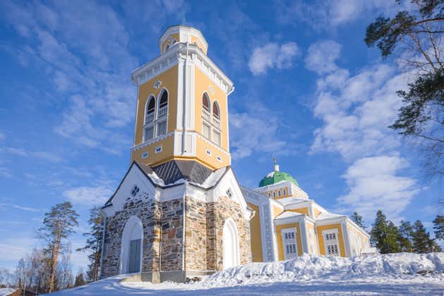 Photo of the 42 meter tall Bell Tower of Kerimäki Church in winter, which is one of the biggest wooden churches in the world, built in 1847.