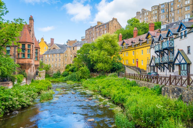 Photo of the scenic Dean Village in a sunny afternoon, in Edinburgh, Scotland.