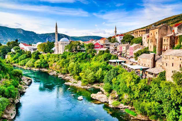 Mostar, Bosnia and Herzegovina. Morning sun on Nerteva River and Old City of Mostar, with Ottoman Mosque.