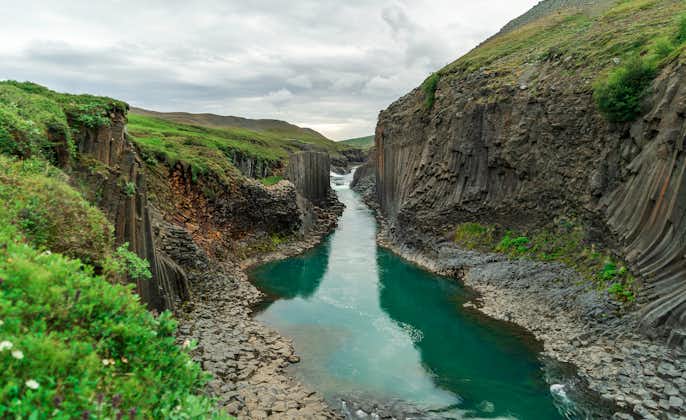 photo of The Green River Through Stuðlagil Canyon, Iceland.