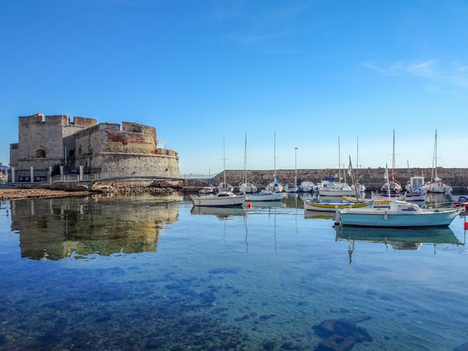 Photo of reflections in the water around the Fort at Toulon, France.