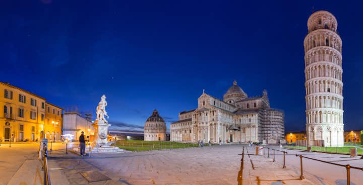 photo of night view of pisa cathedral with leaning tower of pisa on piazza dei miracoli in pisa, Tuscany, Italy.