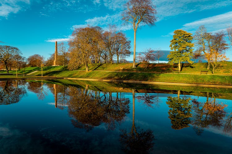 Photo of the Duthie park, Aberdeen, Scotland, with reflections in the early morning light.