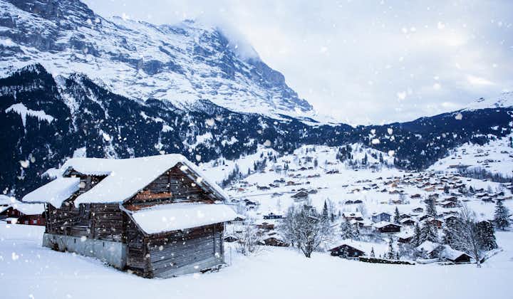 photo of the viewpoint of the Alps Mountains in winter, Grindelwald Switzerland. Swiss ski Alpine mountain resort with famous Eiger, Monch and Jungfrau mountain, Grindelwald, Berner Oberland, Switzerland.