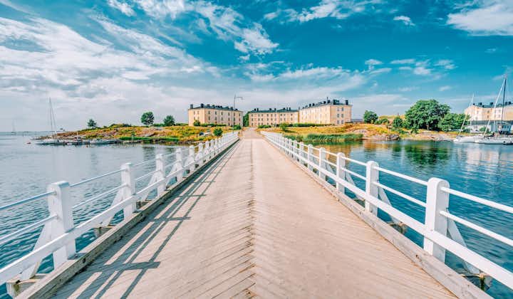 Photo of wooden Bridge Leading To Buildings Of Former Barracks On Territory Of Naval Suomenlinna Fortress Near Helsinki.