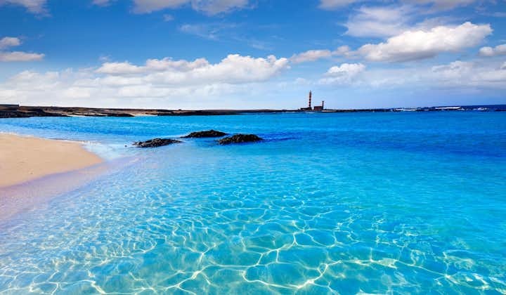 Photo of El Cotillo beach and Toston lighthouse at Fuerteventura Canary Islands.