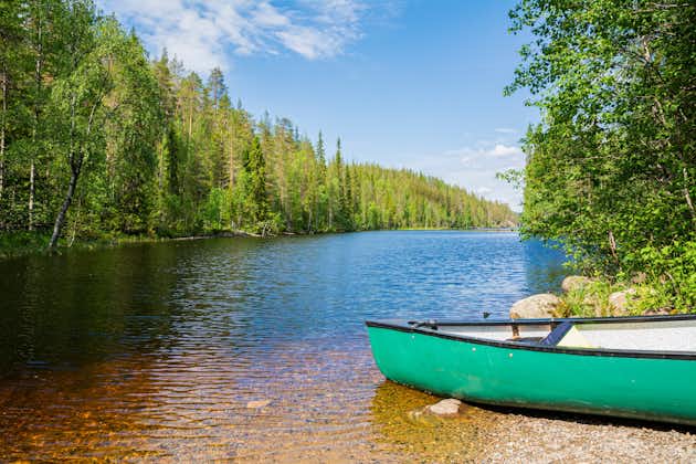 Photo of view of the canyon lake Julma-Olkky and canoe on the shore, Hossa National Park, Kuusamo.