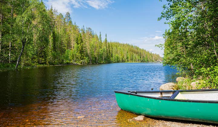 Photo of view of the canyon lake Julma-Olkky and canoe on the shore, Hossa National Park, Kuusamo.