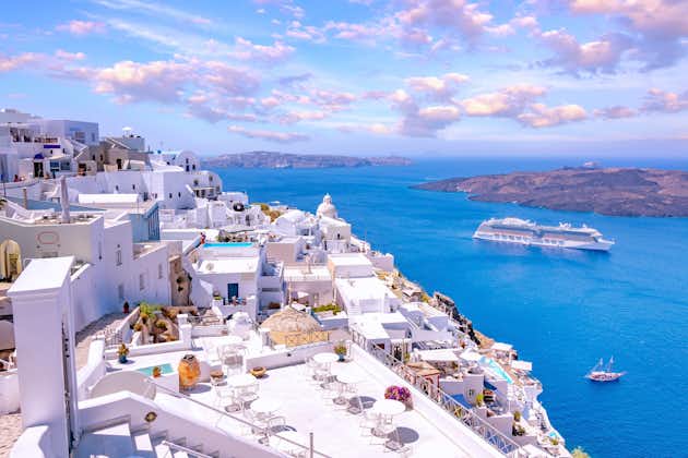 Photo of white architecture on Santorini island with beautiful view on the beach, Greece.