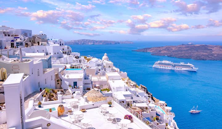 Photo of white architecture on Santorini island with beautiful view on the beach, Greece.
