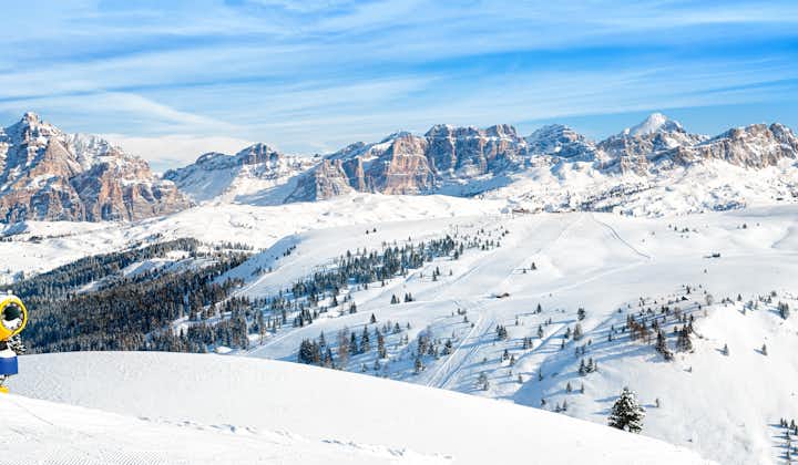 photo of Dolomites mountains. Panoramic view for ski slopes and Marmolada glacier and alta-badia in Italy.
