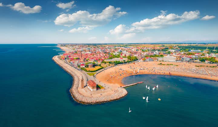 Photo of aerial view of bright cityscape and it's beautiful beaches of Caorle town, Italy.