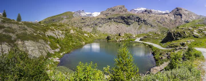 photo of view of Mountain lake in the Monte Rosa massif Ayas Valley, Italy.