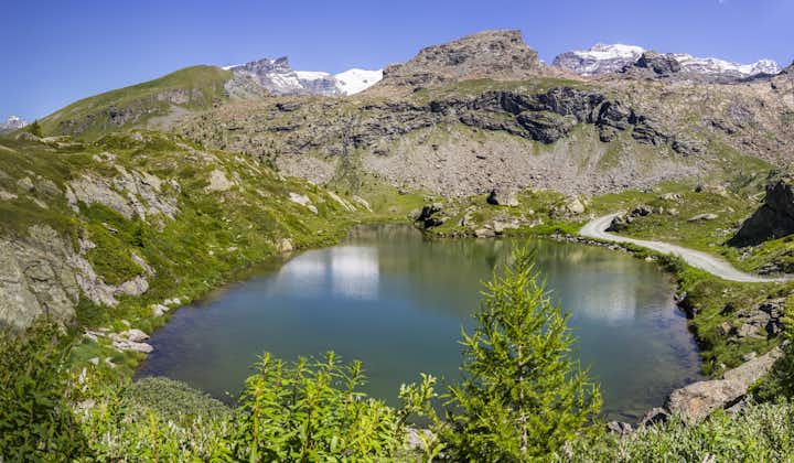 photo of view of Mountain lake in the Monte Rosa massif Ayas Valley, Italy.