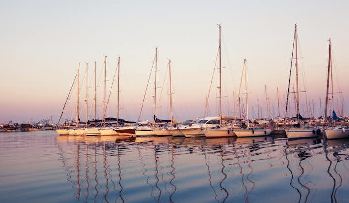 Marina with docked yachts at sunset in Giulianova, Italy.