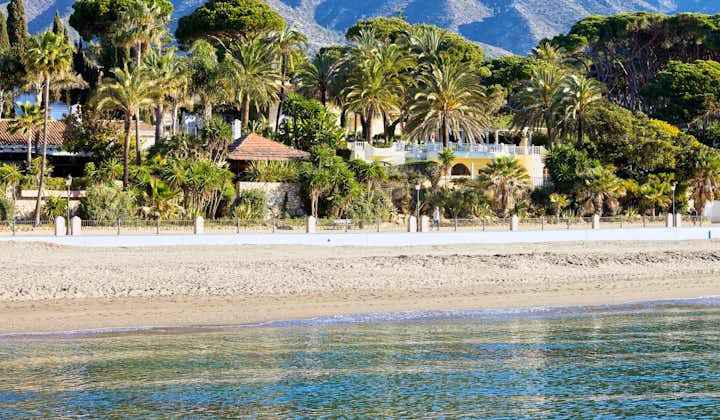 Marbella sandy beach coastline summer holiday scenery by the Mediterranean Sea in Spain, Andalusia region, Costa del Sol, Malaga province.