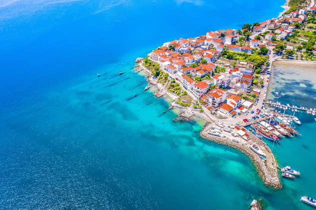 Photo of Coastal  town Stobrec with it's beautiful blue beach, Split Riviera.