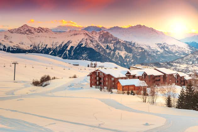 photo of majestic winter sunrise landscape and ski resort in French Alps, La Toussuire, France, Europe.