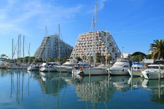 Pyramids buildings and pleasure boats in the seaside resort and marina of la Grande Motte in Herault department, France