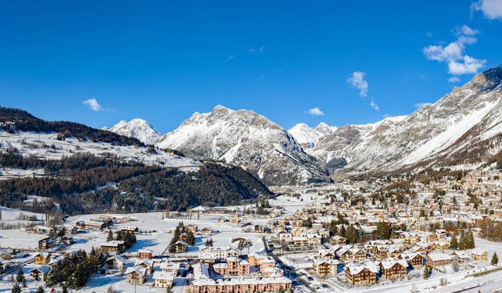photo of panoramic view of Bormio's mountains with town in Italy.