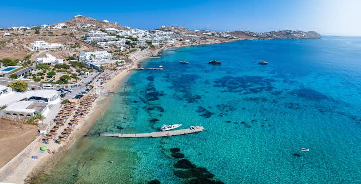 Photo of aerial view the beautiful beach of Agios Ioannis Diakoftis on the island of Mykonos, Cyclades, Greece, during summer time.