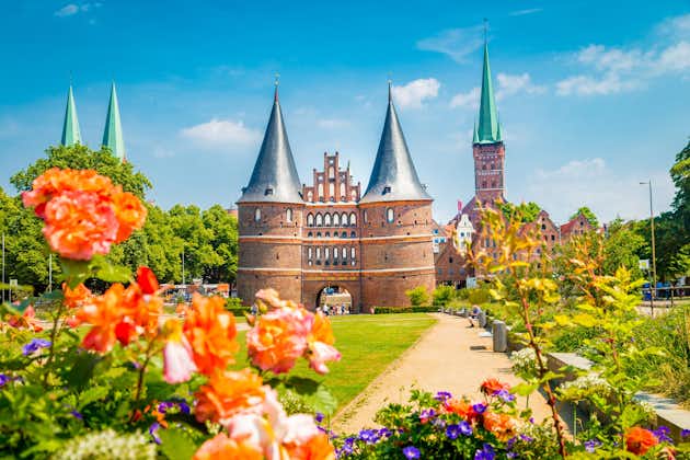 Photo of Historic town of Lubeck with famous Holstentor town gate on a beautiful sunny day with blue sky.