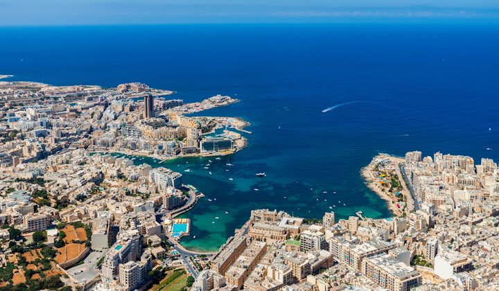 Malta aerial view. St. Julian's (San Giljan) and Tas-Sliema cities. St. Julian’s bay, Balluta bay, Spinola bay, Towns, harbours and coastline of Malta from above. Skyscraper in Paceville district.