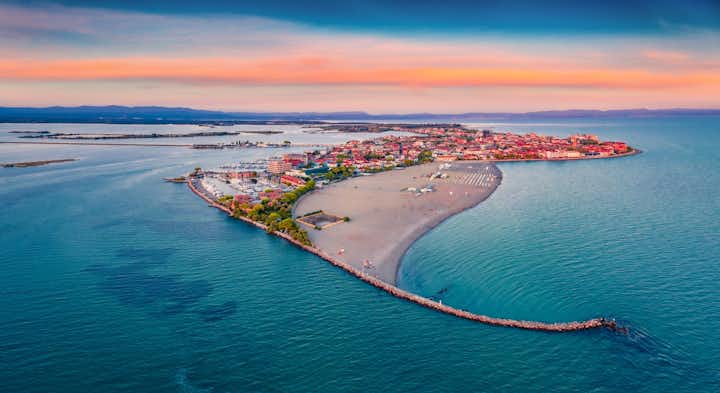 Photo of breathtaking summer view from flying drone of public beach of Grado port, small town located between Venice and Trieste.
