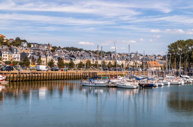 photo of Port of Deauville and city skyline in a sunny summer day, Normandy, France.