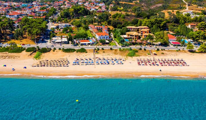 Photo of Skala one of the top beach locations on the Greek island of Kefalonia with soft sand and turquoise water in Kefalonia, Greece.