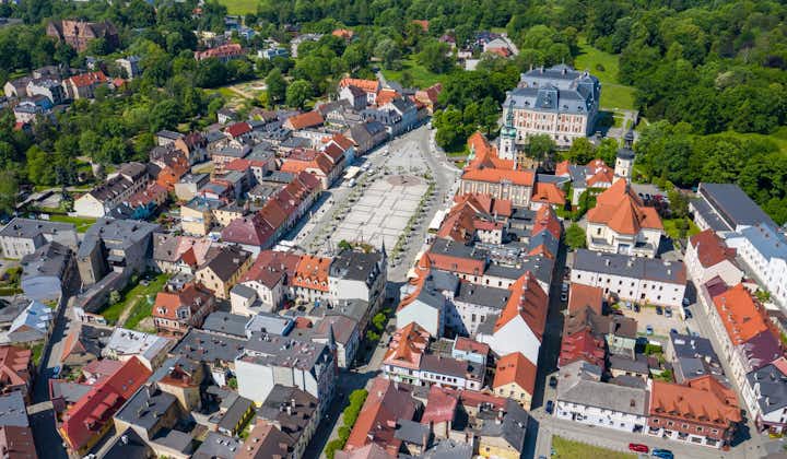 Photo of aerial view of Pszczyna with main market square, colorful old buildings and clear blue sky, Pszczyna, Upper Silesia, Poland.