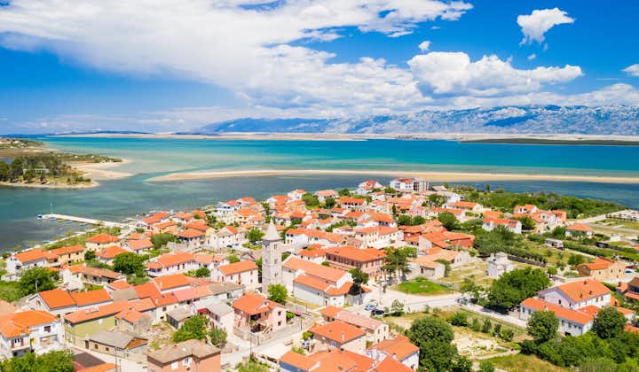 Photo of aerial view of town of Nin with seascape and Velebit mountain in background, Dalmatia, Croatia.