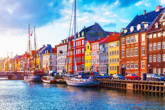 Scenic summer sunset view of Nyhavn pier with color buildings and ships in the Old Town of Copenhagen, Denmark
