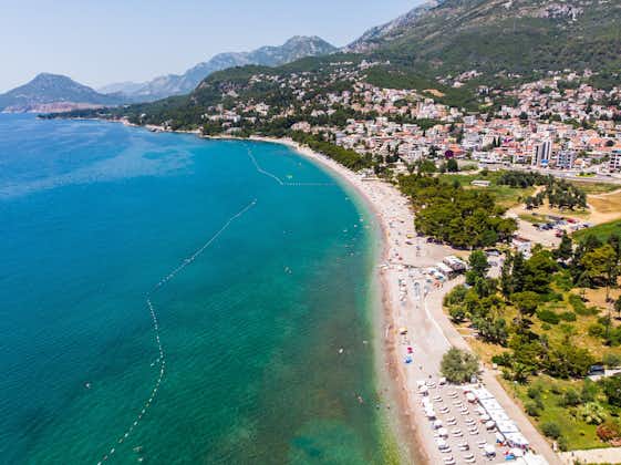 Photo of aerial view of city Bar with blue beach , Montenegro and Adriatic Mediterranean sea.