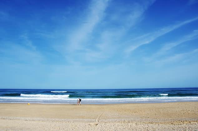 Photo of beautiful blue sea with blue sky in Barril beach, Tavira, Algarve, Portugal.